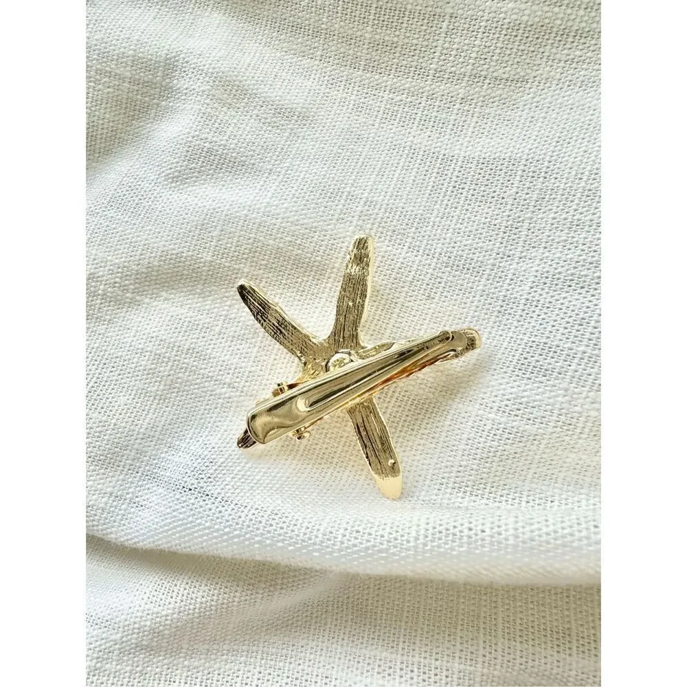 Faux pearl and rhinestone gold starfish hair clip